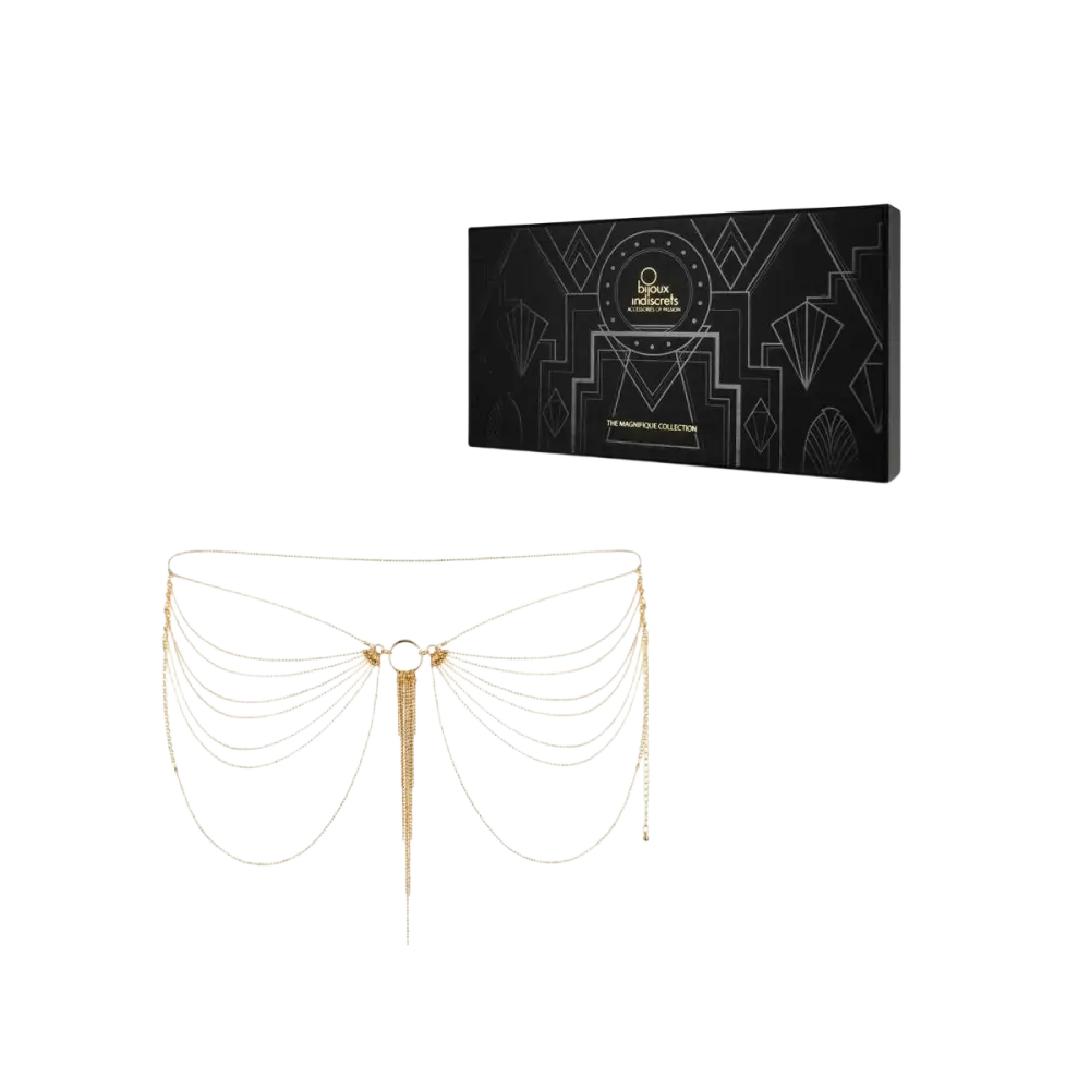 Chaîne corporelle à tons dorés avec plusieurs brins superposés et un pompon central pendant, conçue dans un motif géométrique inspiré de l’art déco.